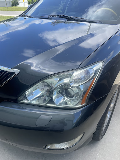 Gray SUV headlight restoration service by Ray’s Luxury Detailing